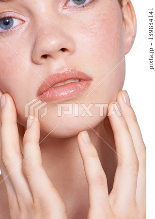 Closeup, skincare and woman in studio with face, hands and white background with natural for beauty, glow and healthy skin. Confident, self care and treatment for smooth, pure and perfect texture 139834141