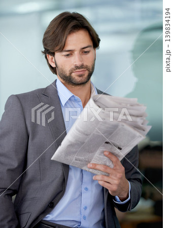 Business man, accountant and reading newspaper for information, article and story update. Male person, professional and stock market announcement for analyst, workplace and knowledge on trading Business man, accountant and reading newspaper for information, article and story update. Male person, professional and stock market announcement for analyst, workplace and knowledge on trading 139834194