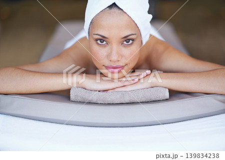 Spa, woman and portrait on massage bed with relax for wellness, zen and beauty treatment for body care. Person, face and stress relief at resort, salon table and peaceful on holiday or vacation Spa, woman and portrait on massage bed with relax for wellness, zen and beauty treatment for body care. Person, face and stress relief at resort, salon table and peaceful on holiday or vacation 139834238