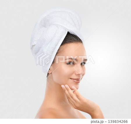 Woman, skincare and beauty in studio portrait, confidence and proud of results on white background. Happy female person, towel and smile for facial treatment, cosmetics and dermatology for grooming Woman, skincare and beauty in studio portrait, confidence and proud of results on white background. Happy female person, towel and smile for facial treatment, cosmetics and dermatology for grooming 139834266
