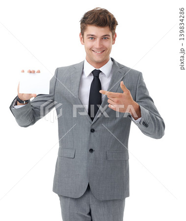 Portrait, consultant or man with a poster, pointing or employee isolated on white studio background. Paper, promotion or model with blank card or mockup space with review, information or announcement 139834286