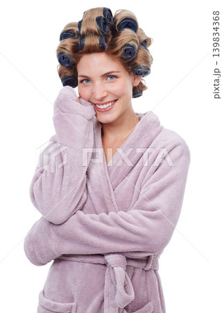 Portrait, hair and woman with curlers for hairstyle, routine and smiling in studio for pamper. Female person, cosmetic treatment and rollers for grooming, white background and tools for beauty Portrait, hair and woman with curlers for hairstyle, routine and smiling in studio for pamper. Female person, cosmetic treatment and rollers for grooming, white background and tools for beauty 139834368