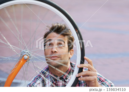 City, check and man with bicycle wheel, sunshine and road with guy and transportation with sustainability. Bike inspection, person and hipster with maintenance and eco friendly with cycling and Italy 139834510