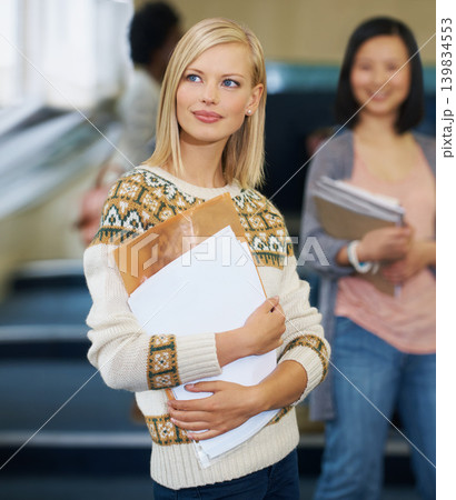 Student, thinking and lecture education in hall at USA university for knowledge scholarship, college or future. Woman, thoughts and paperwork at academy for phd degree or diploma, campus or classroom 139834553