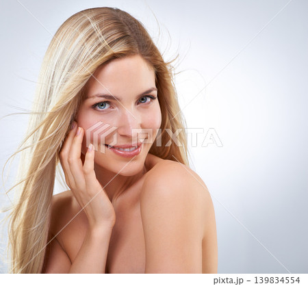 Hair care, hand and beauty portrait of happy woman, makeup or isolated on white studio background. Face, touch or hairstyle of blonde model in cosmetics, skin and salon treatment on mockup with wind Hair care, hand and beauty portrait of happy woman, makeup or isolated on white studio background. Face, touch or hairstyle of blonde model in cosmetics, skin and salon treatment on mockup with wind 139834554