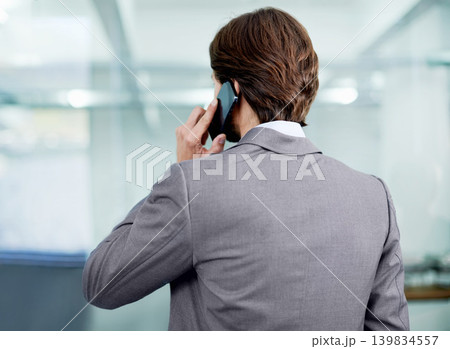 Businessman, planning and phone call for networking in office, communication and app for conversation. Male person, negotiation and connection for opportunity, talking and back for speaking at work 139834557