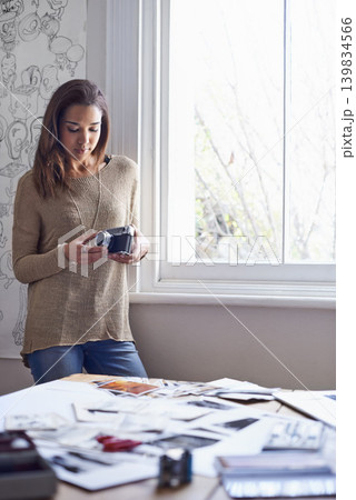 Woman, photographer and vintage camera in creative studio with images of portfolio or art project, proposal or career. Female person, equipment and pictures or concept board or retro, hobby or prints Woman, photographer and vintage camera in creative studio with images of portfolio or art project, proposal or career. Female person, equipment and pictures or concept board or retro, hobby or prints 139834566