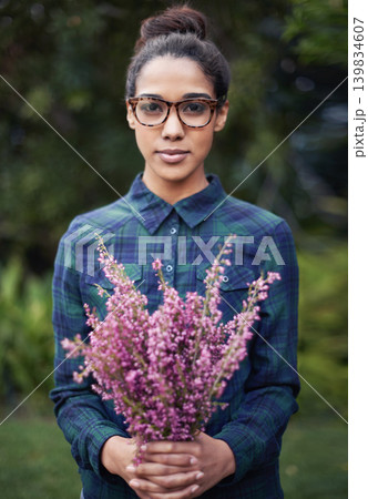 Woman, flower bouquet and portrait in garden, nature and blossom with environment, relax in Spring with gift outdoor. Purple plant, present and botanical with sustainability and romantic gesture Woman, flower bouquet and portrait in garden, nature and blossom with environment, relax in Spring with gift outdoor. Purple plant, present and botanical with sustainability and romantic gesture 139834607