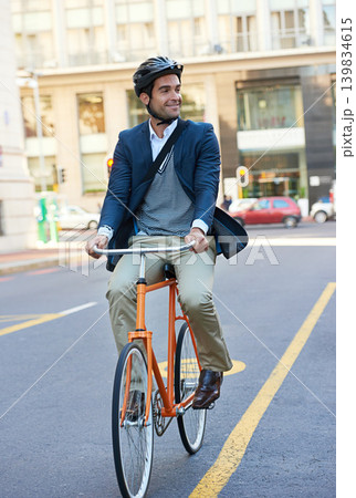 Morning, commute and city road of businessman with bicycle for green and sustainable transportation. Cyclist, smile and bike for carbon footprint in New York by urban street with entrepreneur cycling Morning, commute and city road of businessman with bicycle for green and sustainable transportation. Cyclist, smile and bike for carbon footprint in New York by urban street with entrepreneur cycling 139834615