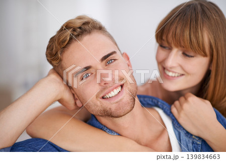 Closeup, couple and together in house with smile on date and romance to enjoy. Man, love and hug by partner, cute and moment with pride on face and lovers in relationship with happiness in life Closeup, couple and together in house with smile on date and romance to enjoy. Man, love and hug by partner, cute and moment with pride on face and lovers in relationship with happiness in life 139834663