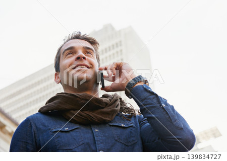 City, phone call and man with smile, conversation and communication with network and happy. Person, low angle and connection with smartphone and mobile user with sunshine and contact with urban town City, phone call and man with smile, conversation and communication with network and happy. Person, low angle and connection with smartphone and mobile user with sunshine and contact with urban town 139834727