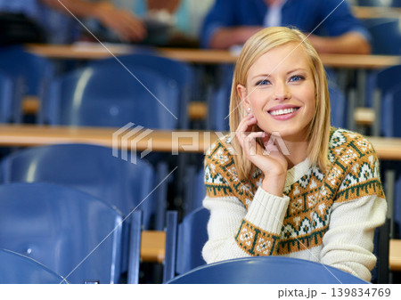 Happy, student and learning in class at university, lecture and listening to professor in education hall. College, campus and smile for studying course in school for project, research or knowledge Happy, student and learning in class at university, lecture and listening to professor in education hall. College, campus and smile for studying course in school for project, research or knowledge 139834769