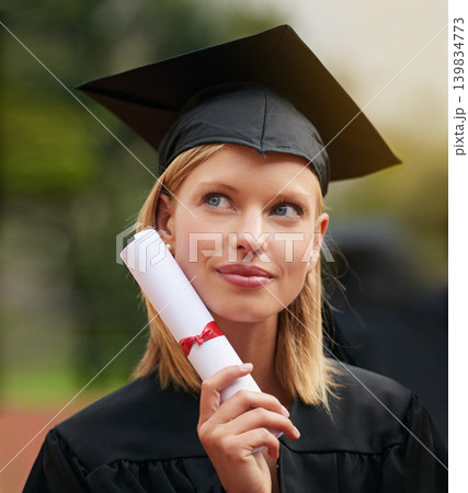 Graduation, certificate and vision with student woman outdoor on campus for university or college event. Future, planning and thinking with young graduate at school for education or scholarship 139834773