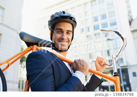 Morning, commute and portrait of businessman with bicycle for green and sustainable transportation. Cyclist, smile and bike for carbon footprint in New York by urban street with entrepreneur cycling Morning, commute and portrait of businessman with bicycle for green and sustainable transportation. Cyclist, smile and bike for carbon footprint in New York by urban street with entrepreneur cycling 139834798
