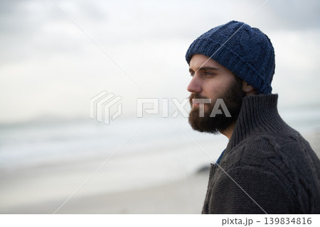 Thinking, calm and man at beach with memory, nostalgia or reflection with ocean view in nature. Remember, travel and male person at sea for fresh air, journey or peaceful Florida vacation in winter 139834816