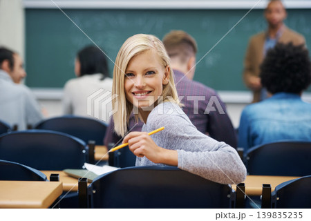 University student, portrait and smile at classroom desk in London for english lecture, education or scholarship. Female person, face and pen at academy with professor for teaching, lesson or exam University student, portrait and smile at classroom desk in London for english lecture, education or scholarship. Female person, face and pen at academy with professor for teaching, lesson or exam 139835235