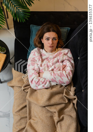 Adult woman lying awake trying to sleep feeling restless frustrated insomnia mood top view at night Adult woman lying awake trying to sleep feeling restless frustrated insomnia mood top view at night 139835377