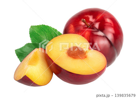 fresh red plum half with leaves isolated on white background fresh red plum half with leaves isolated on white background 139835679