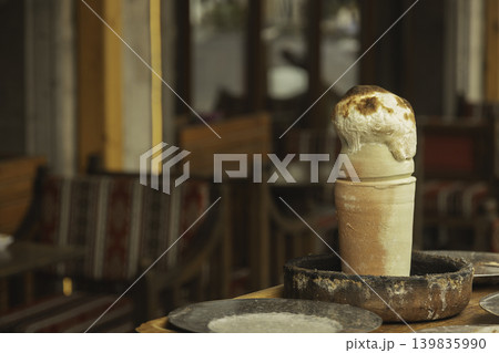 Famous Turkish dish testi kebab or kebab in pot, stew of meat and vegetables in clay pot with bread lid Famous Turkish dish testi kebab or kebab in pot, stew of meat and vegetables in clay pot with bread lid 139835990