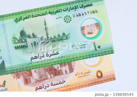 Emirates banknote money cash with UAE dirham banknotes, financial payment currency exchange from United Arab Emirates Emirates banknote money cash with UAE dirham banknotes, financial payment currency exchange from United Arab Emirates 139836545