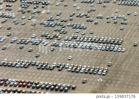 Automotive industry. Import or export of new cars at production factory warehouse. Vehicles for sale at logistics business parking lot Automotive industry. Import or export of new cars at production factory warehouse. Vehicles for sale at logistics business parking lot 139837176