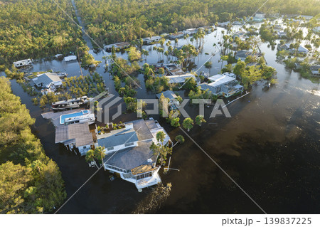 Flooded houses by hurricane rainfall in Florida residential area. Consequences of natural disaster 139837225