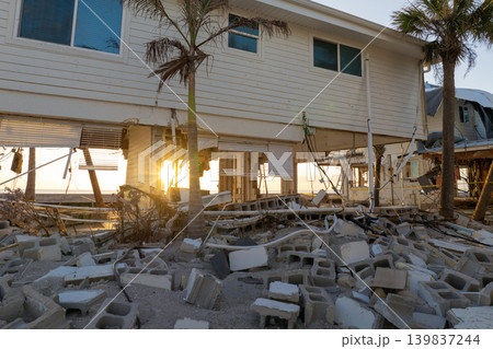Destroyed houses on ocean shore after hurricane Milton landfall. Natural disaster consequences on Manasota Key, Florida. Storm surge severe damage Destroyed houses on ocean shore after hurricane Milton landfall. Natural disaster consequences on Manasota Key, Florida. Storm surge severe damage 139837244