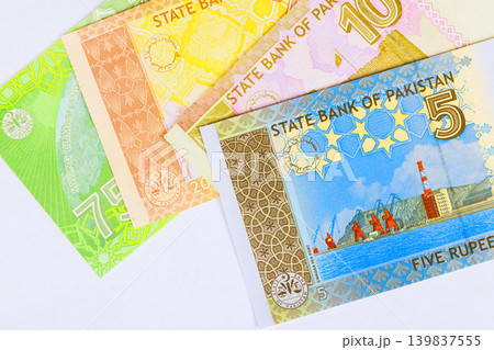 Pakistani rupee paper currency banknotes in various denominations issued by State Bank of Pakistan as financial cash Pakistani rupee paper currency banknotes in various denominations issued by State Bank of Pakistan as financial cash 139837555