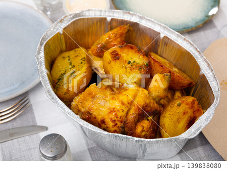 Nice dish of baked whole chicken with potatoes served in deep bowl Nice dish of baked whole chicken with potatoes served in deep bowl 139838080