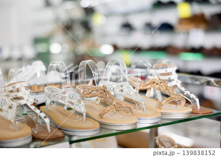 Fashionable summer women shoes on the shelves of shoe store Fashionable summer women shoes on the shelves of shoe store 139838152