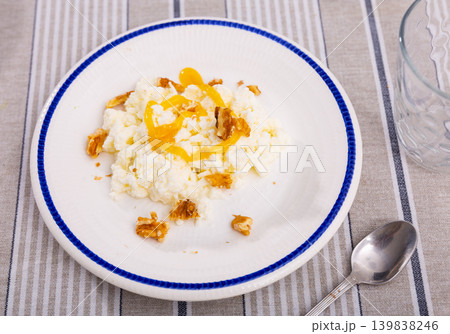 Portion of traditional Catalan dessert, mato with honey and nuts Portion of traditional Catalan dessert, mato with honey and nuts 139838246