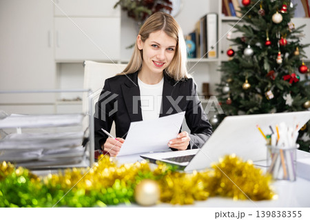Woman working with documents during Christmas 139838355