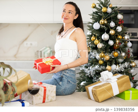.in homely atmosphere, girl is waiting for new year .in homely atmosphere, girl is waiting for new year 139838356