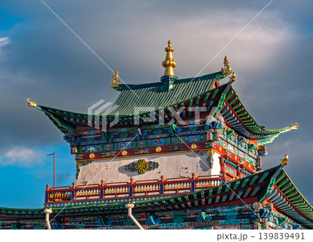 Vibrant Ivolginsky Datsan temple building details display green tiered roofs, golden spire, and intricate facade decorations 139839491