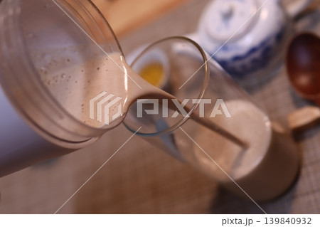 Pouring Creamy Beverage into Glass 139840932