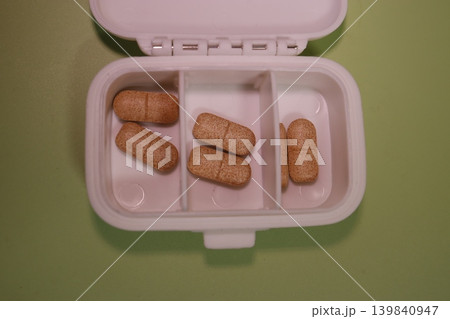 Pill Organizer with Brown Pills Pill Organizer with Brown Pills 139840947