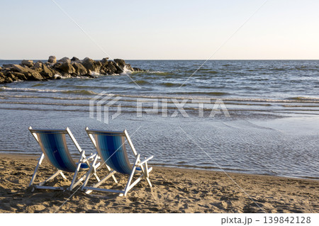 Two beach chairs on the beach on the Tyrrhenian Sea Two beach chairs on the beach on the Tyrrhenian Sea 139842128