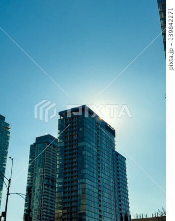 Skyline view of modern buildings under clear sky in daytime during morning hours Skyline view of modern buildings under clear sky in daytime during morning hours 139842271