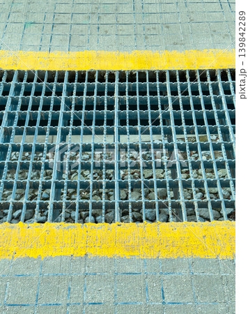 View of grid surface on a construction site with yellow line marking in bright sunlight during midday hours 139842289
