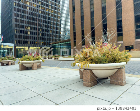 City street with planters and buildings during a cloudy day in the downtown area City street with planters and buildings during a cloudy day in the downtown area 139842403