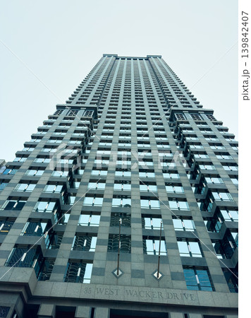 Tall building at 35 West Wacker Drive in Chicago showcasing urban design and modern architecture in daylight Tall building at 35 West Wacker Drive in Chicago showcasing urban design and modern architecture in daylight 139842407
