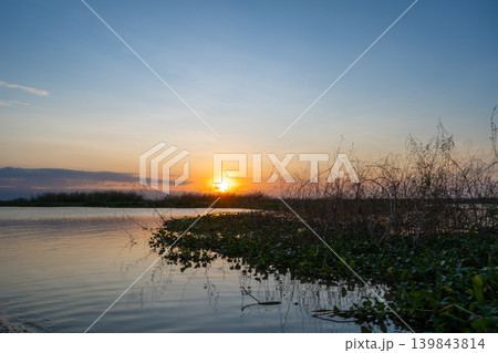 Sunset over Lake Tempe in Sulawesi, Indonesia's peaceful waters 139843814