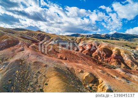 Colorful hills of Altai Mars show various earthy tones, the area is marked by unique patterns and shapes formed by natural processes over time 139845137