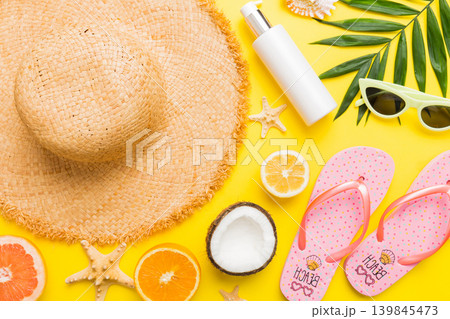 Top view of various seashells placed near colorful fruit and stylish summer accessories on table background. Summer concept. Flat lay. Top view with copy space for text Top view of various seashells placed near colorful fruit and stylish summer accessories on table background. Summer concept. Flat lay. Top view with copy space for text 139845473