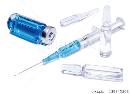 Ampules, phial and syringe with blue vaccine 139845808
