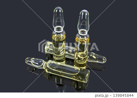 Medical glass ampoules with light yellow vaccine Medical glass ampoules with light yellow vaccine 139845844
