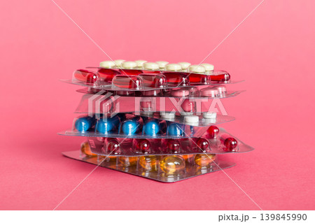 too many different pill cartridges stacked. selective Focus. Packs of blister pills with tablets. Colored pastilles packages. A pile of medicine in blister packs. Pharmaceutical blister packs too many different pill cartridges stacked. selective Focus. Packs of blister pills with tablets. Colored pastilles packages. A pile of medicine in blister packs. Pharmaceutical blister packs 139845990