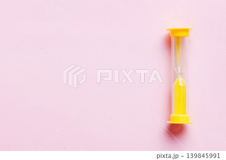 hourglass on the table, sand clock as time passing concept for business deadline, copy space hourglass on the table, sand clock as time passing concept for business deadline, copy space 139845991