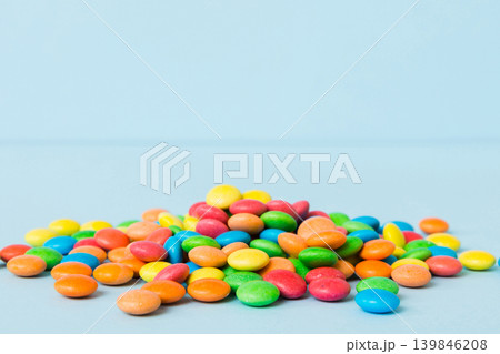 Pile of delicious colorful sweet candies on colored background top view. Confectionery decor Pile of delicious colorful sweet candies on colored background top view. Confectionery decor 139846208