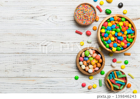 different colored round candy in bowl and jars. Top view of large variety sweets and candies with copy space 139846243